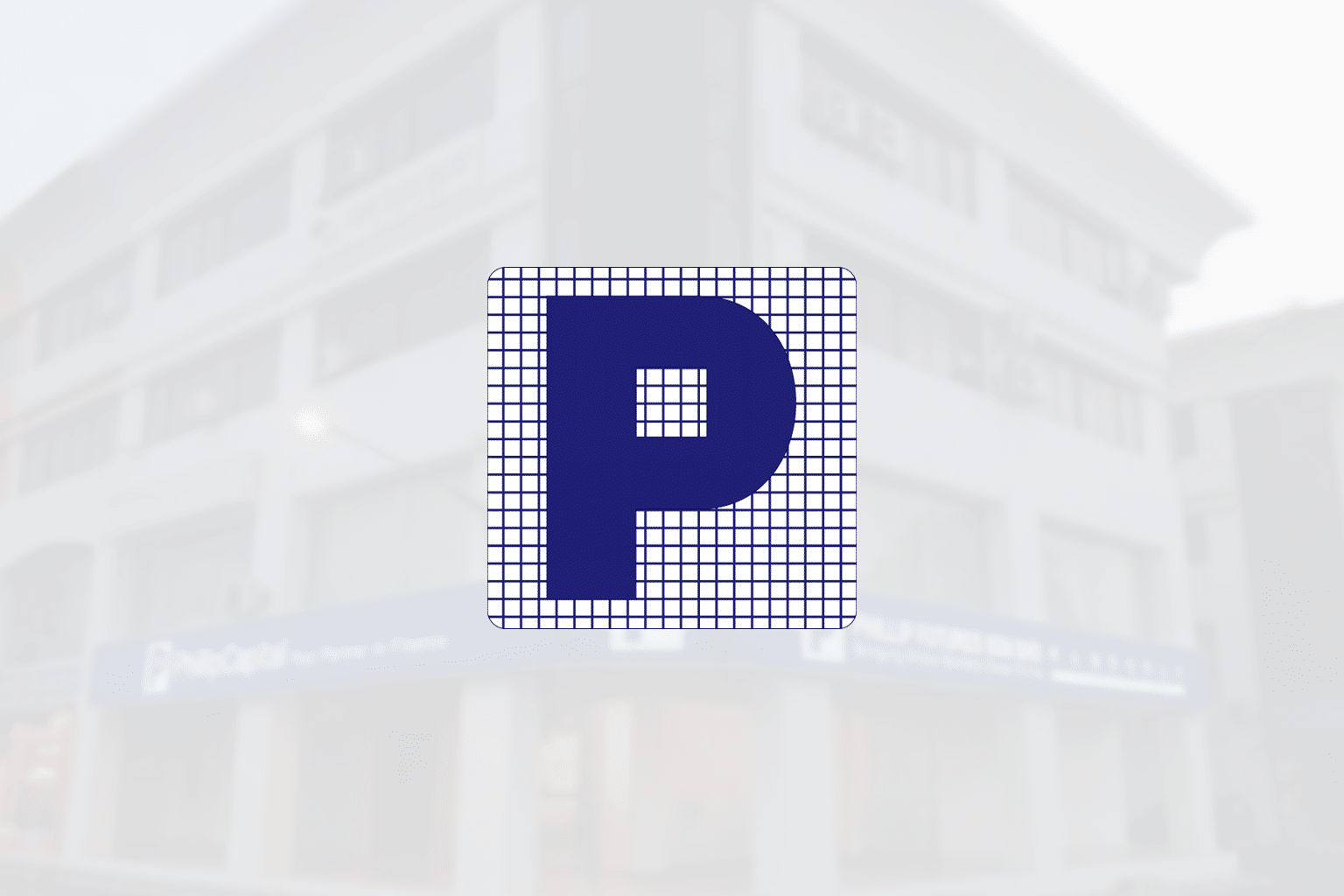 PhillipCapital logo displayed on a blurred building background